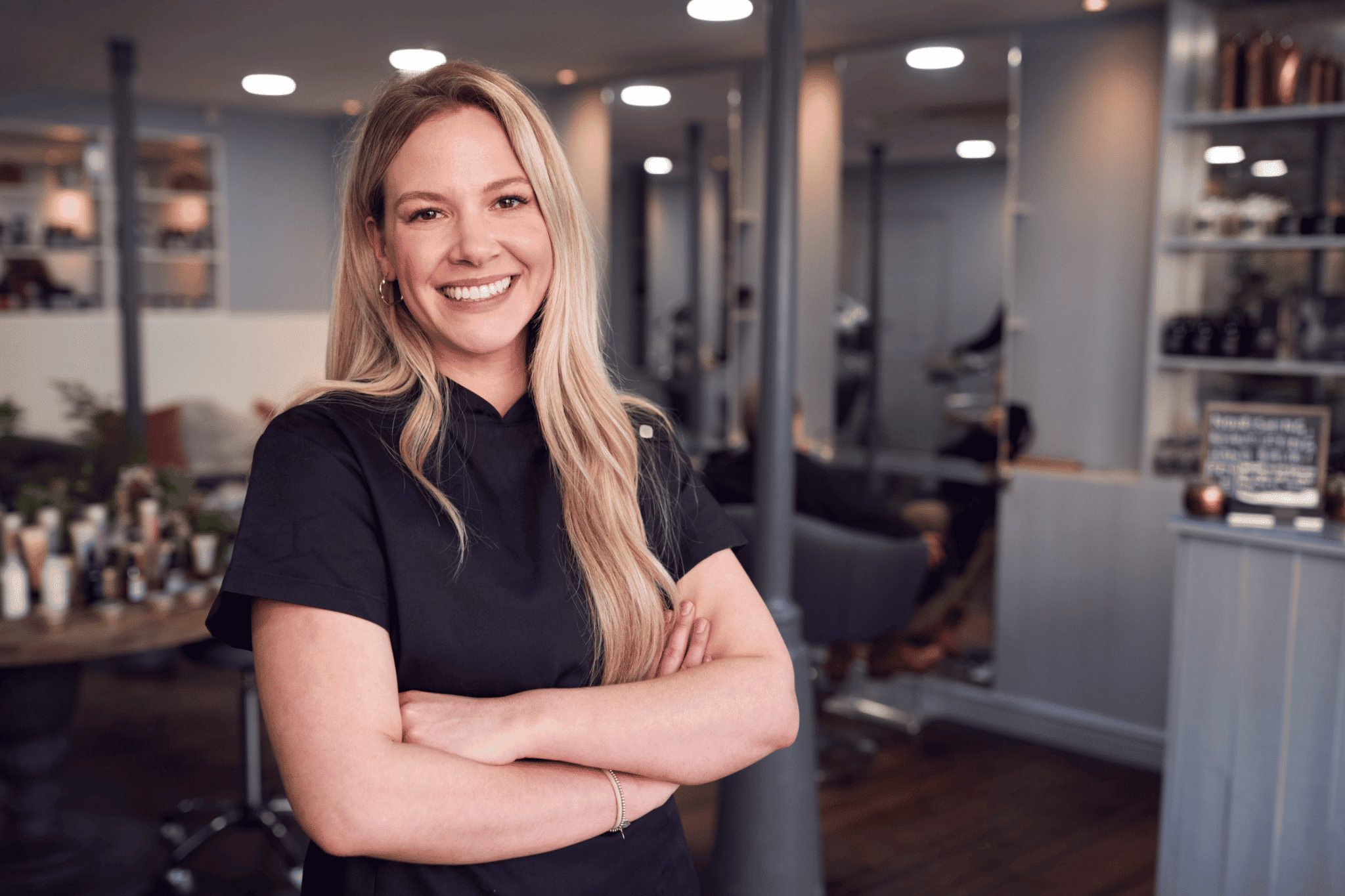 beauty salon owner smiling in professional atire