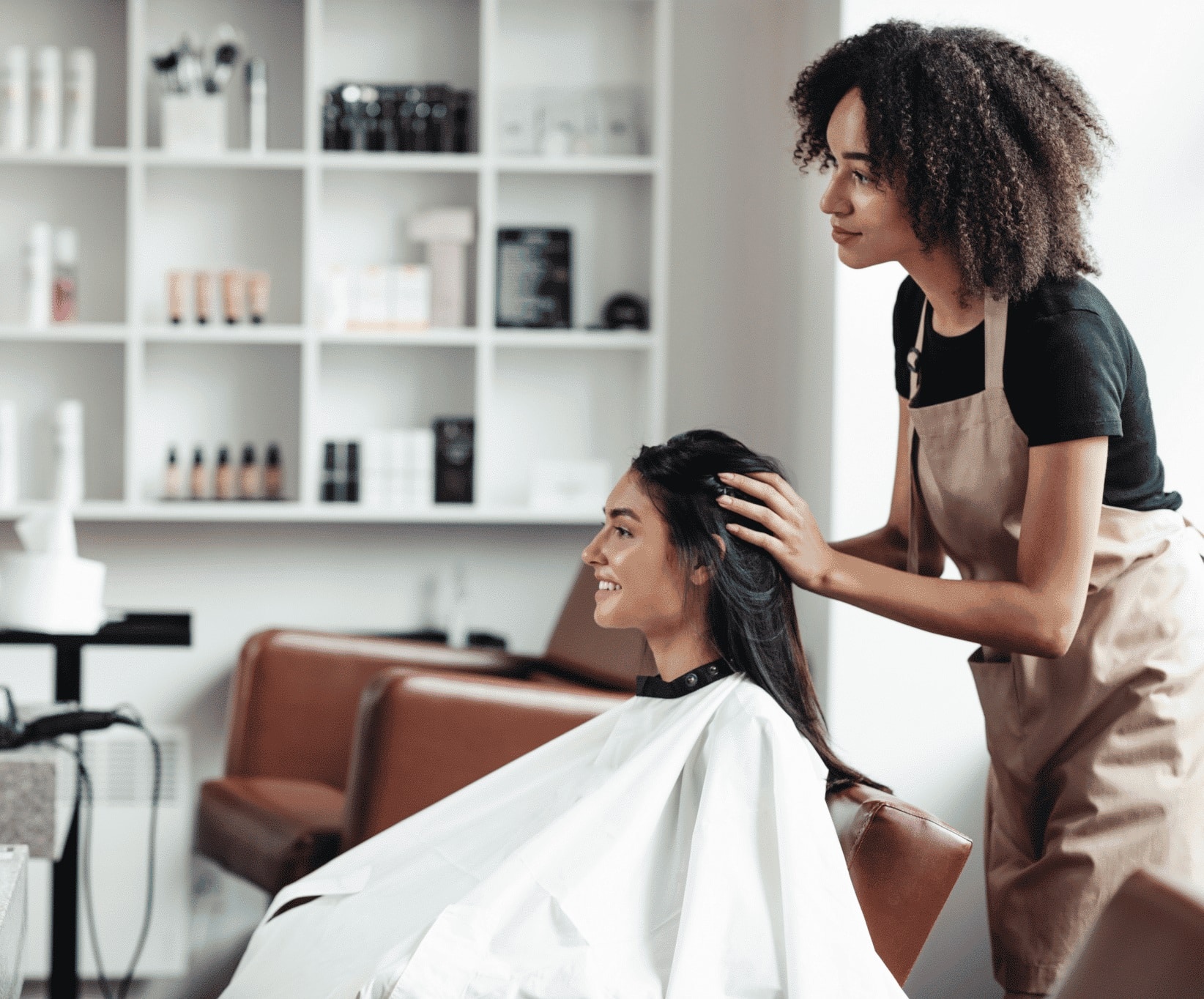 hair dresser serving a client in a salon