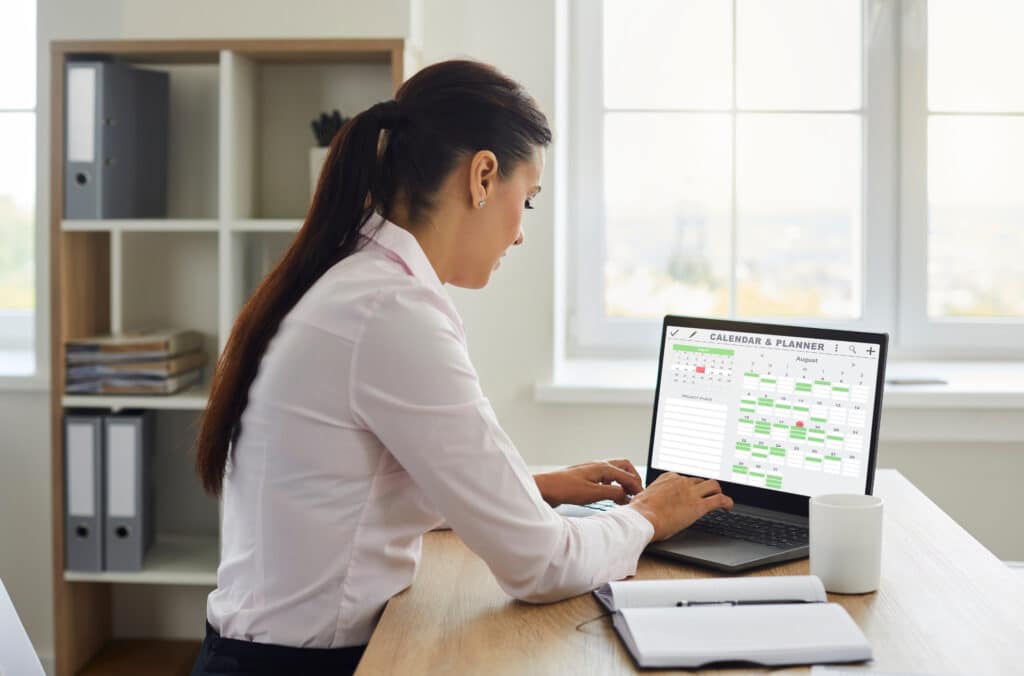 business admin managing scheduling and organizing her work