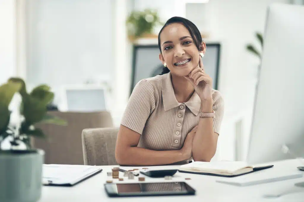 happy administrator managing business at office setting smiling