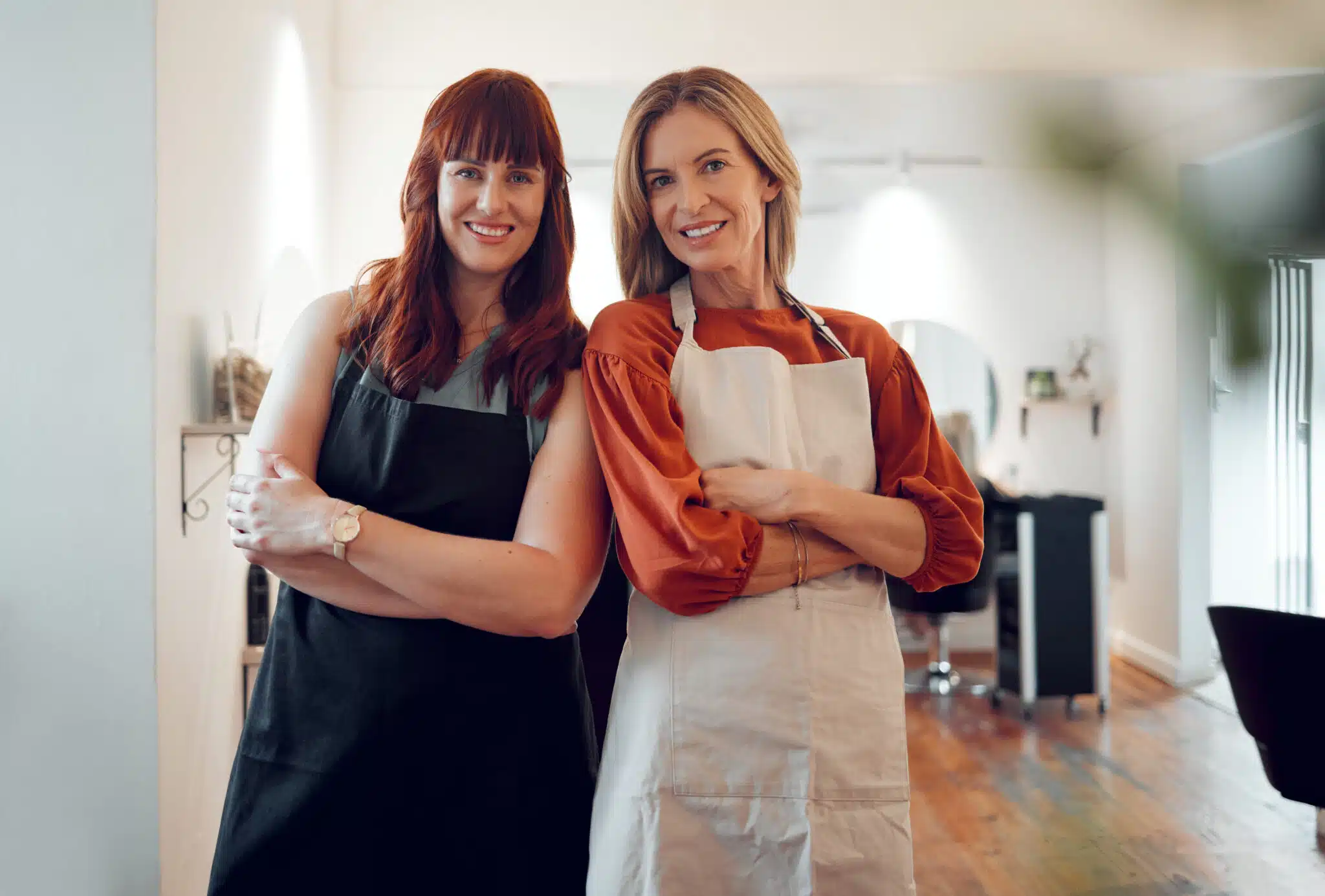 happy hair salon owners standing in their small business together