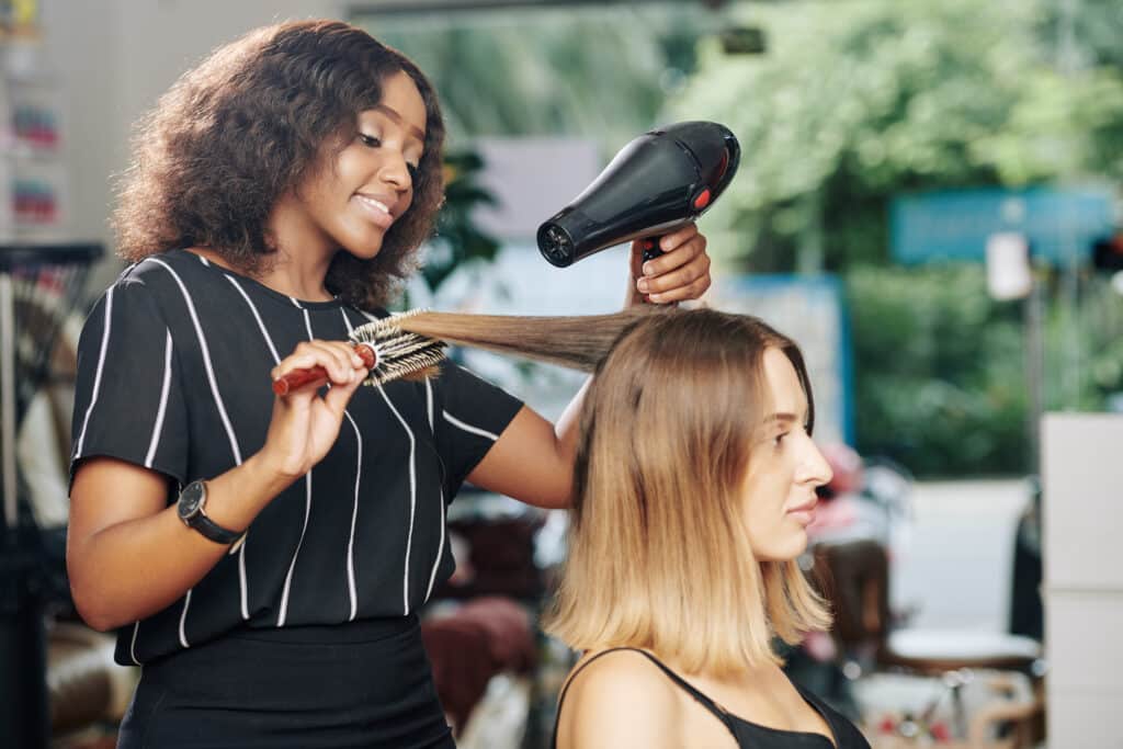 hairdresser working in beauty salon