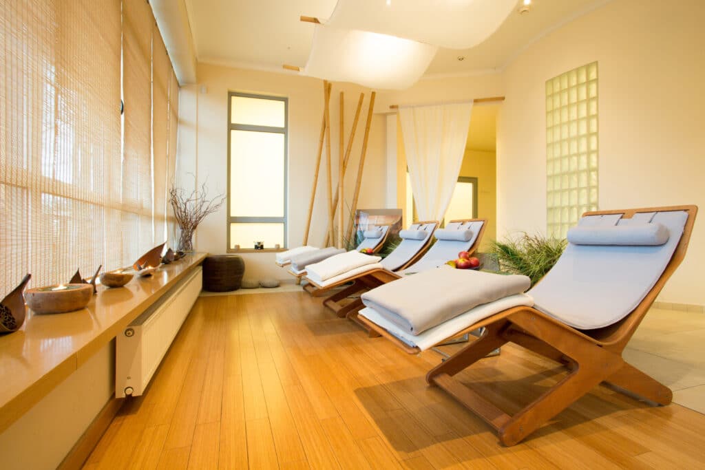 rest area of a spa facility with chairs to relax and wooden floor
