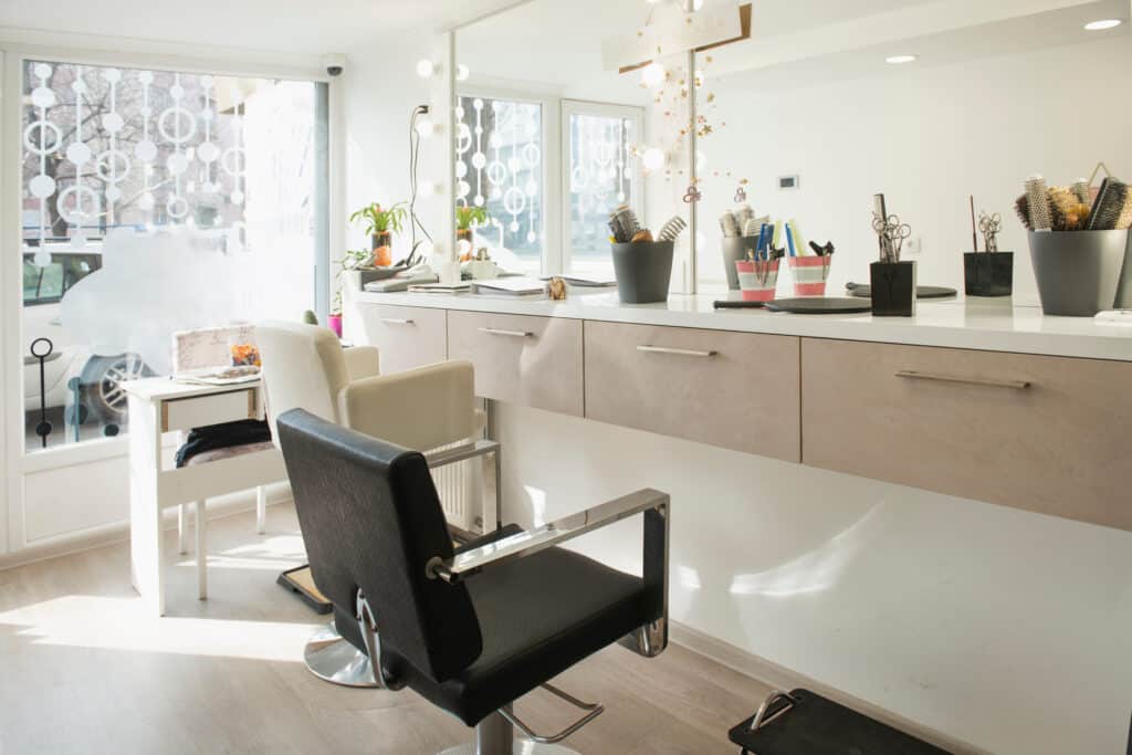 small salon interior design with abundant light and mirrors