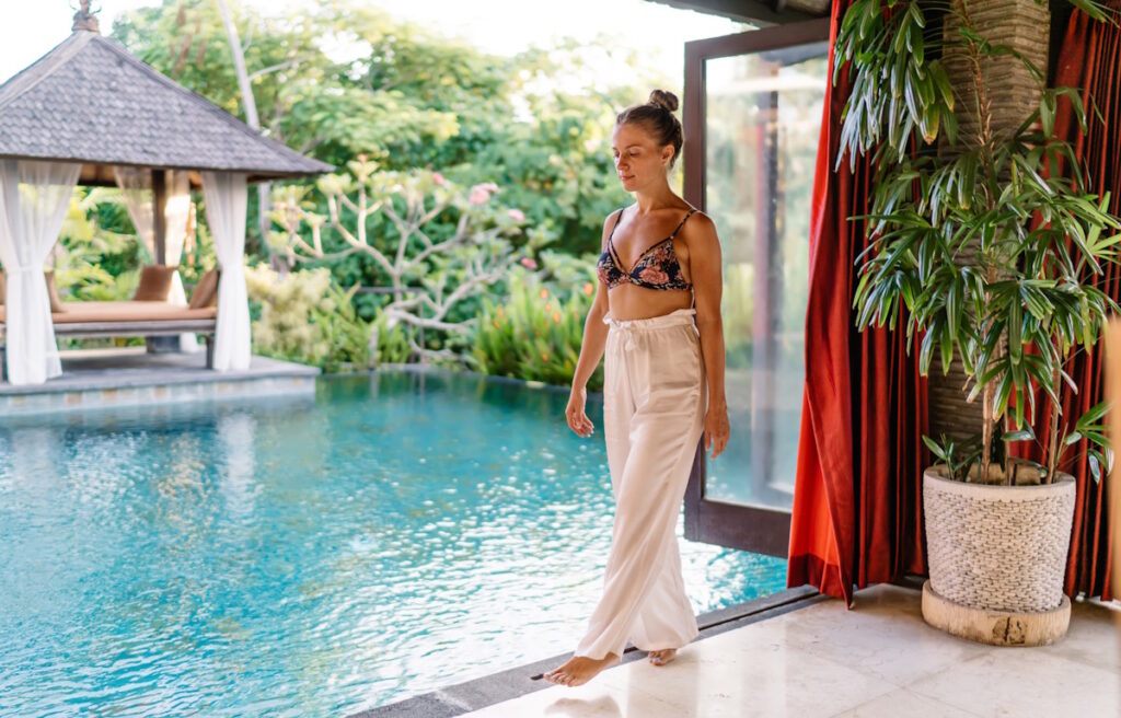spa customer relaxing near swimming pool